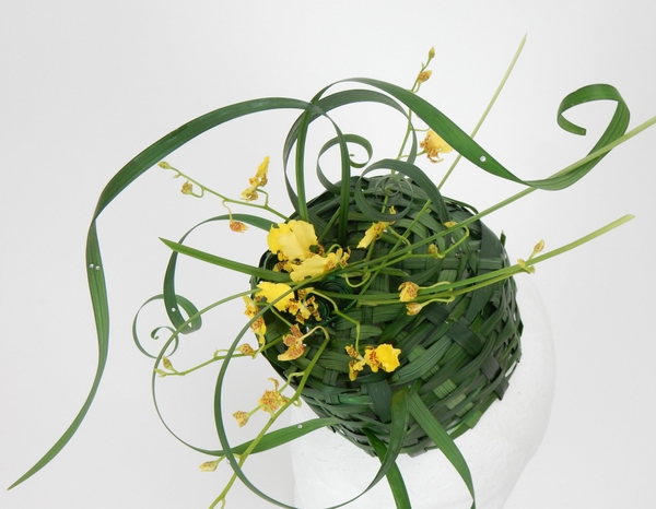 Pillbox hat woven from lily grass with oncidium orchids Pillbox hat woven from lily grass with oncidium orchids
