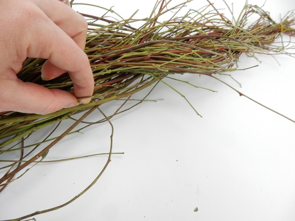 Hook your finger around individual twigs to pull it from the braid Hook your finger around individual twigs to pull it from the braid