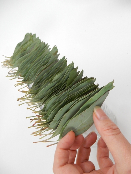 Place a small drop of floral glue on the wire ends and glue a leave to hide