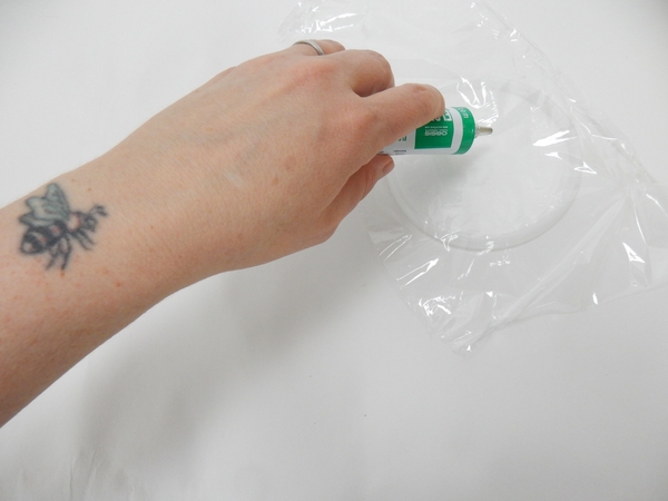 Pour out some floral glue in a flat container Pour out some floral glue in a flat container