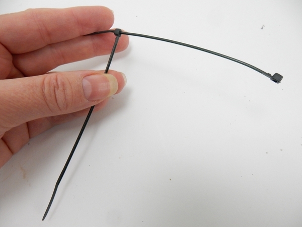 Simply slip one cable tie through another to the point where it just catch Simply slip one cable tie through another to the point where it just catch