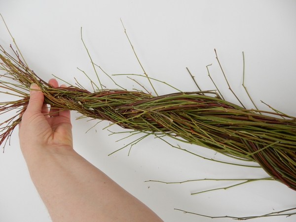 Start at the thin end and braid the stems together. Start at the thin end and braid the stems together.