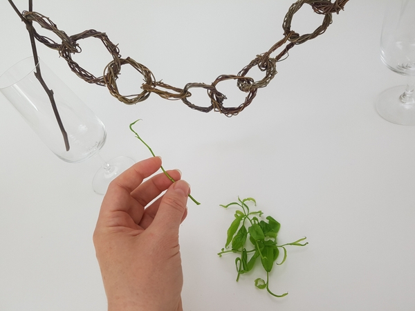 Strip a few green weaving strips of foliage. Strip a few green weaving strips of foliage.