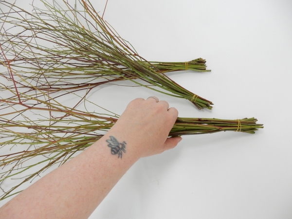 Tie the bundles of twigs at one end Tie the bundles of twigs at one end