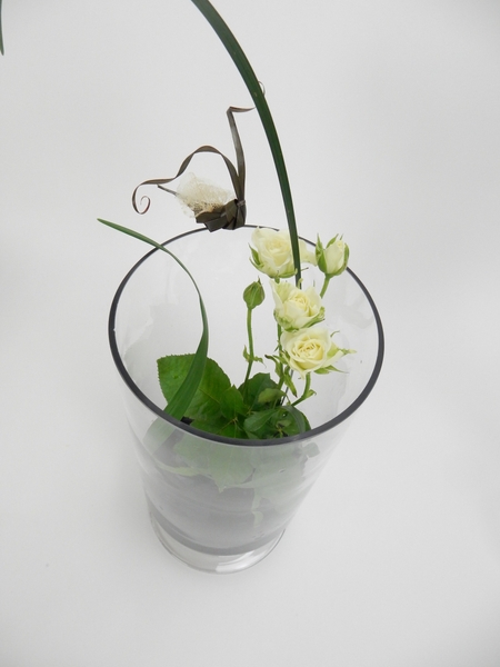 Set roses in a vase with a Kenzan Set roses in a vase with a Kenzan