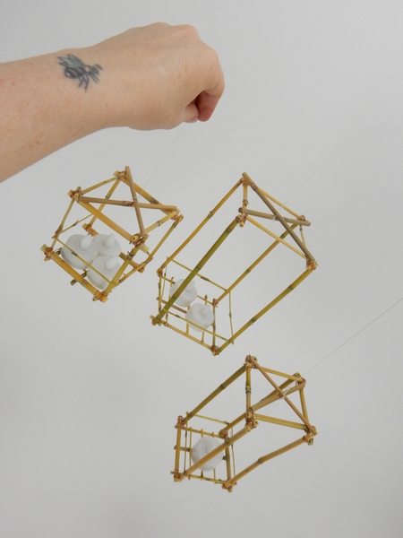 Place the tea lights in the lanterns and hang Place the tea lights in the lanterns and hang