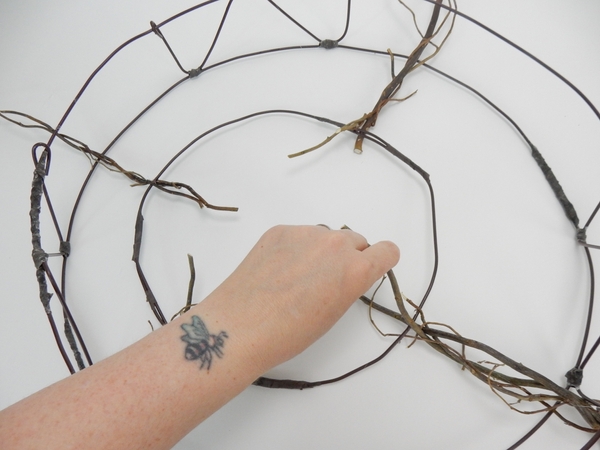 Glue the twigs so that it radiates out from a central point Glue the twigs so that it radiates out from a central point