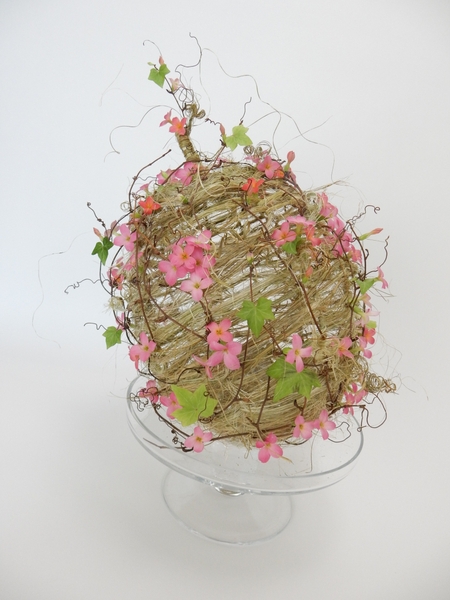 Ivy and flax and kalanchoe wrapped woven pumpkin Ivy and flax and kalanchoe wrapped woven pumpkin