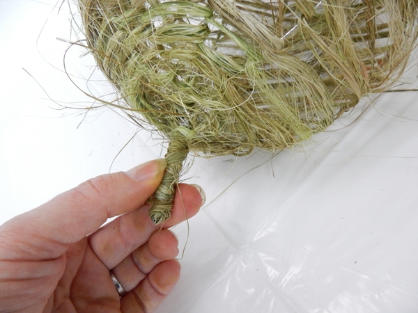 Secure the flax at the stalk with a knot Secure the flax at the stalk with a knot
