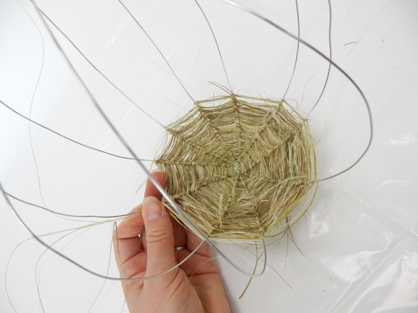 Spiral the flax out and around to cover the wire Spiral the flax out and around to cover the wire