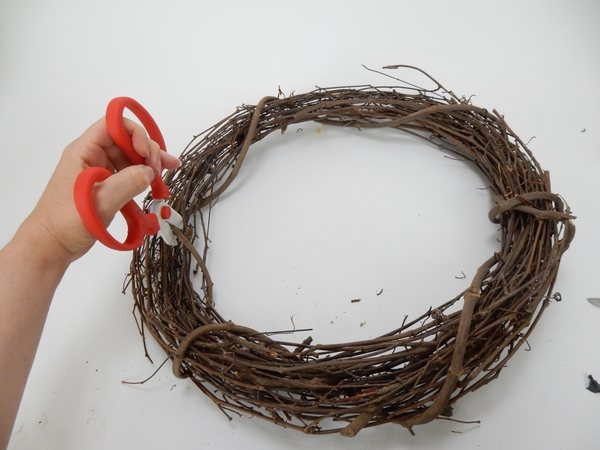 Clip the bits of wreath that keeps it all together Clip the bits of wreath that keeps it all together