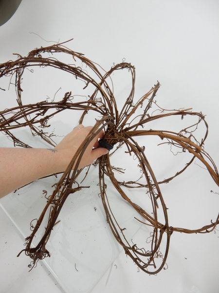 Cover the ties with brown florist tape Cover the ties with brown florist tape
