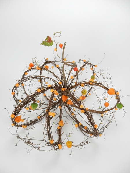 Kalanchoe and Physalis on a woven wreath pumpkin Kalanchoe and Physalis on a woven wreath pumpkin