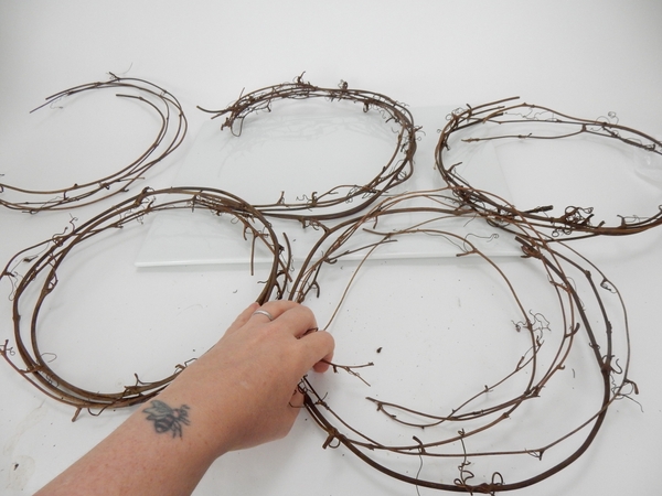 Reshape and weave the vines into smaller wreaths Reshape and weave the vines into smaller wreaths