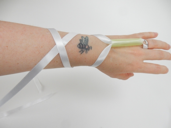 Slip the loop over your ring finger Slip the loop over your ring finger