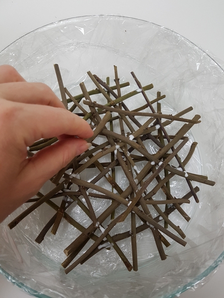 The twigs should extend to touch the sides of the container to follow the shape The twigs should extend to touch the sides of the container to follow the shape