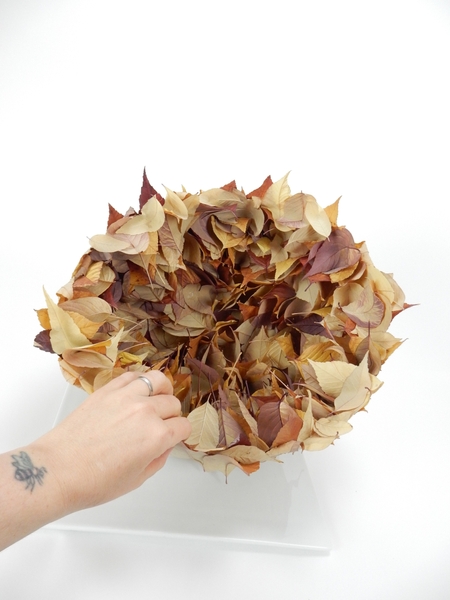 Add a few leaves to look like the are resting lightly on the edge. Add a few leaves to look like the are resting lightly on the edge.