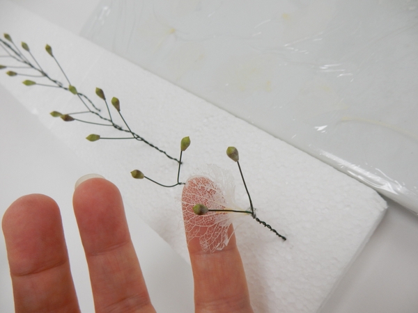 Glue four petals to a wire Glue four petals to a wire