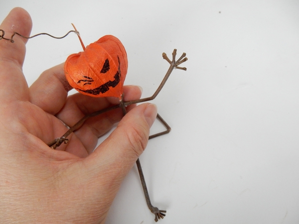 Glue the arms and legs to a twig body Glue the arms and legs to a twig body