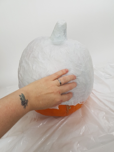 I placed about 3 layers of tissue paper on the pumpkin shape before setting it aside to dry. I placed about 3 layers of tissue paper on the pumpkin shape before setting it aside to dry.