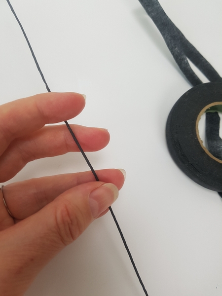Wrap two long wires with tape Wrap two long wires with tape