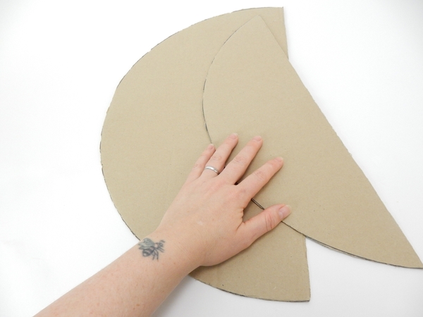 Cut a second circle just slightly less than half Cut a second circle just slightly less than half