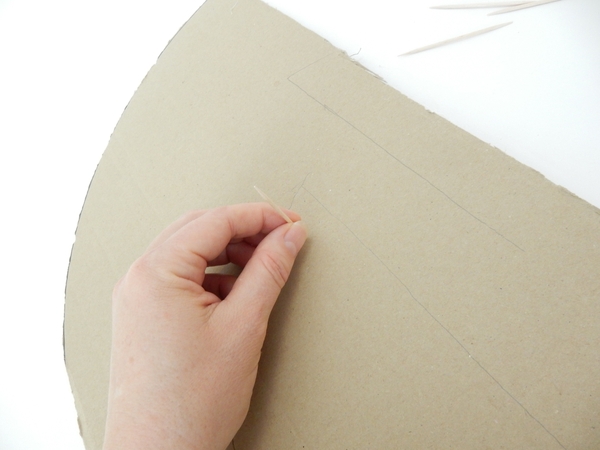 Pierce a cocktail stick through the cardboard to create a spacer between the layers Pierce a cocktail stick through the cardboard to create a spacer between the layers