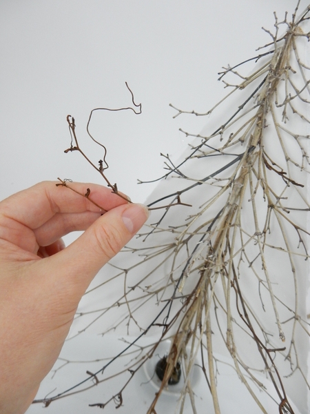 Add a few vine tendrils between the twigs Add a few vine tendrils between the twigs