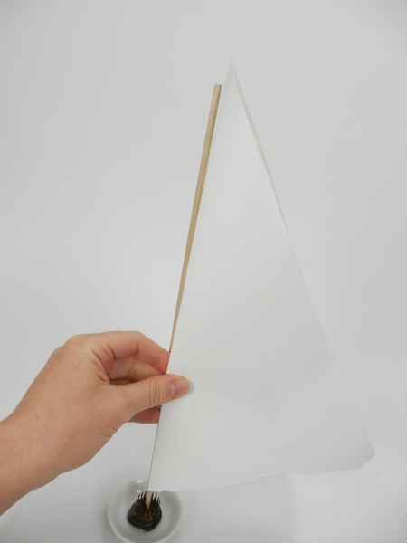 Fold a piece of paper in half and measure it against the dowel Fold a piece of paper in half and measure it against the dowel