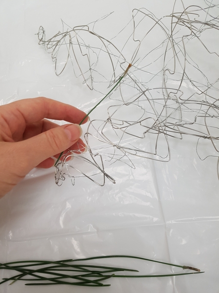 Glue pine needles to the wire Glue pine needles to the wire