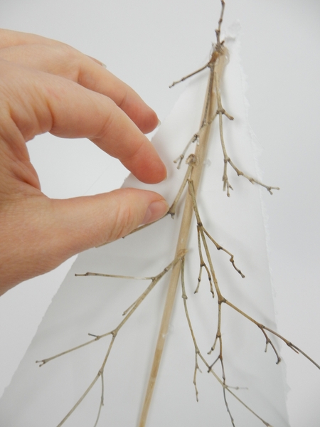 Place all the twigs to slope out and then slightly lift up Place all the twigs to slope out and then slightly lift up