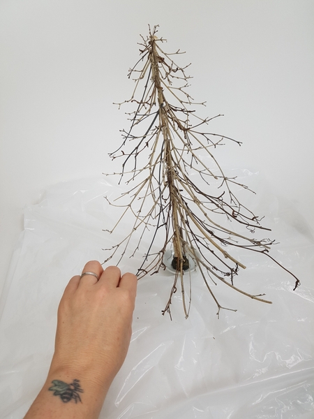Turn the tree around and use the twigs as a guide to add twig snippets to the other side Turn the tree around and use the twigs as a guide to add twig snippets to the other side