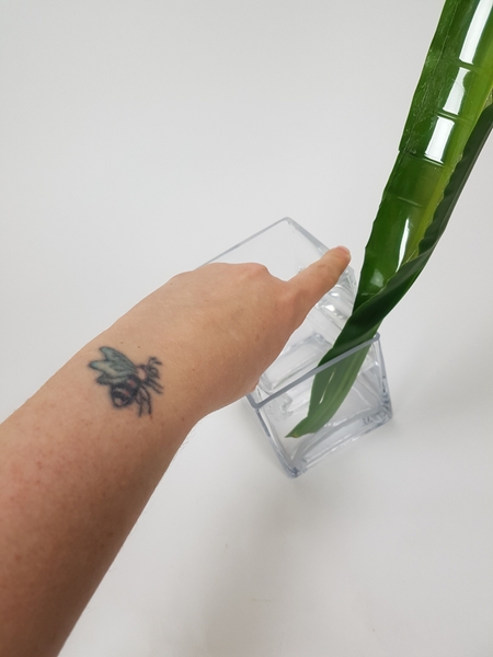 Place the leaf in a vase Place the leaf in a vase
