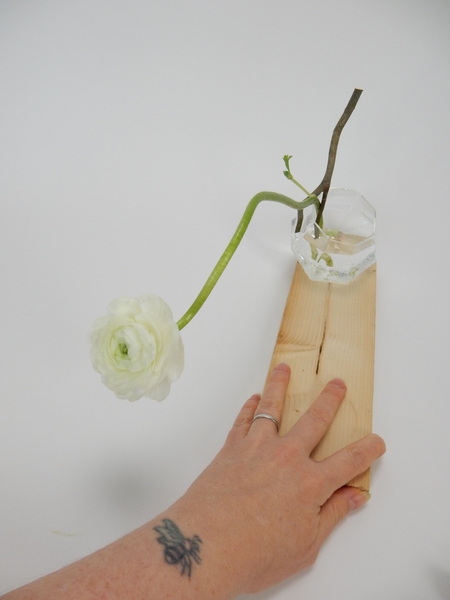 Position the vase on the display surface Position the vase on the display surface