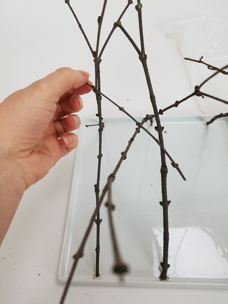 Add in a few cross twigs to connect the legs Add in a few cross twigs to connect the legs