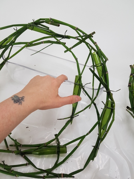 Lean the wreath so that it is almost upright to fill the tubes Lean the wreath so that it is almost upright to fill the tubes