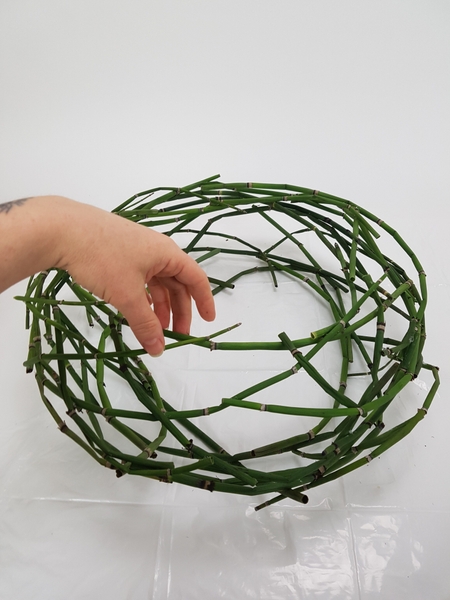 Place the two wreaths on top of each other and secure Place the two wreaths on top of each other and secure