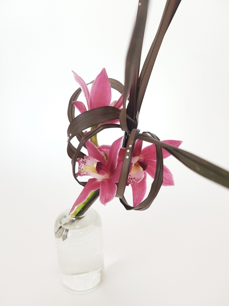 Cymbidium and Phormium flower arrangement Cymbidium and Phormium flower arrangement