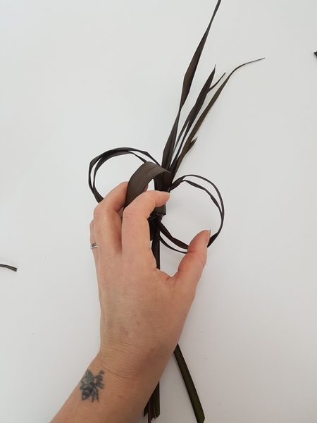 Flair out the looped strands to fan open Flair out the looped strands to fan open