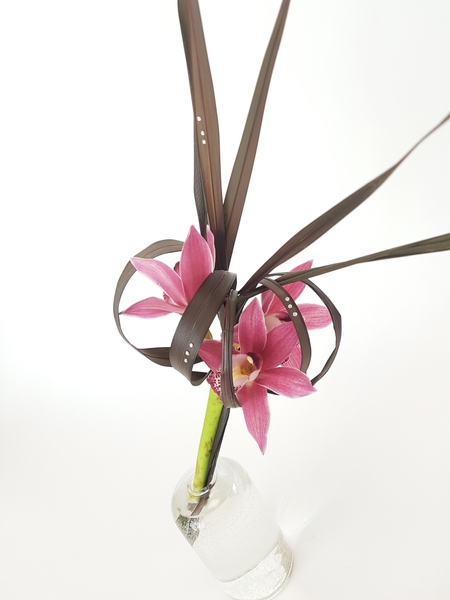 Flax an boat orchids flower arrangement. Flax an boat orchids flower arrangement.