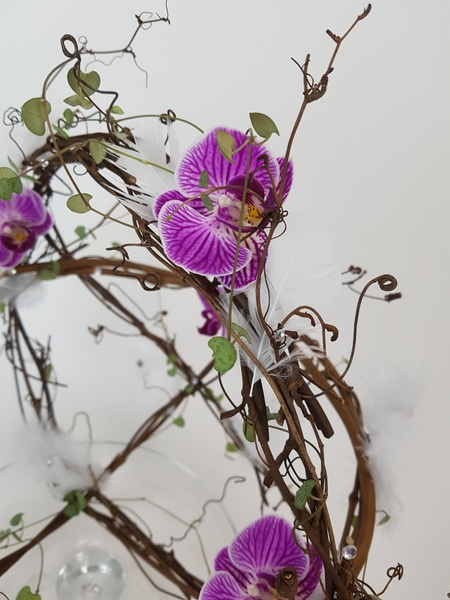 Phalaenopsis and rosary vine spring basket design Phalaenopsis and rosary vine spring basket design