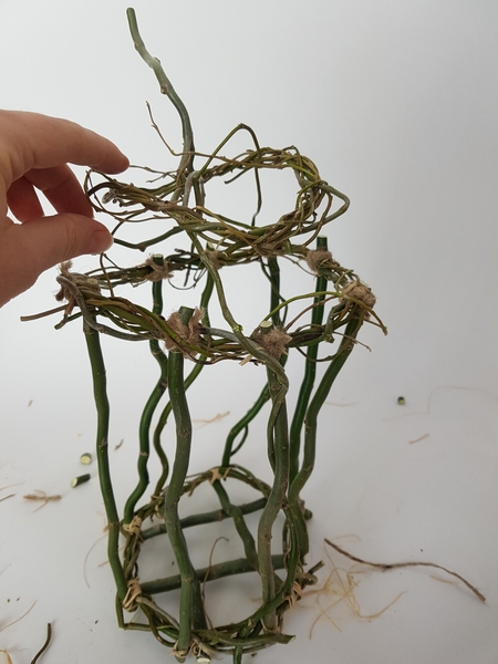 Weave the smaller wreath to fit on the top, open ended wreath. Weave the smaller wreath to fit on the top, open ended wreath.