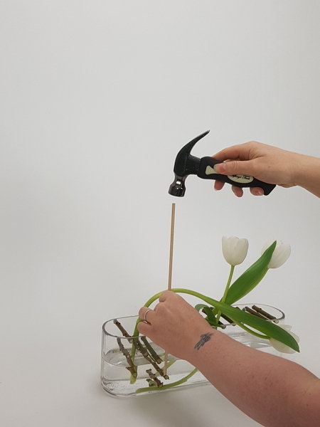 Adjust the position of the twigs by tapping it into position with a dowel and hammer Adjust the position of the twigs by tapping it into position with a dowel and hammer