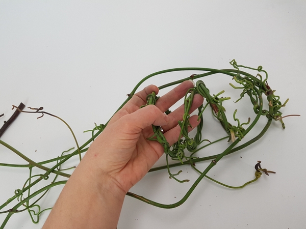 Fold the vines up and place the other wreaths inside