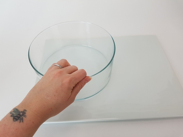 Place a container on a display surface Place a container on a display surface