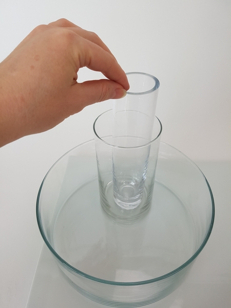 Place an even smaller container inside the second container Place an even smaller container inside the second container