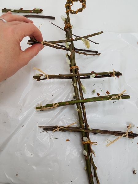 Secure the twigs with raffia or willow Secure the twigs with raffia or willow