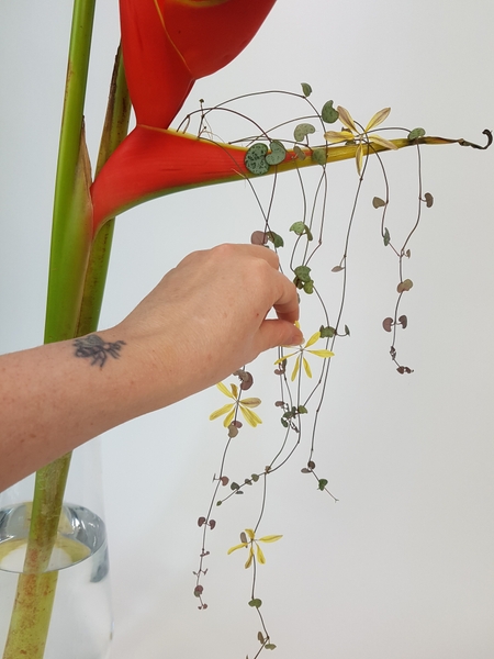 Glue in petal sun flakes to tumble down the design Glue in petal sun flakes to tumble down the design