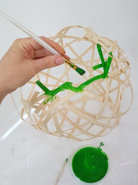 Remove the clips and paint the globe green. Remove the clips and paint the globe green.