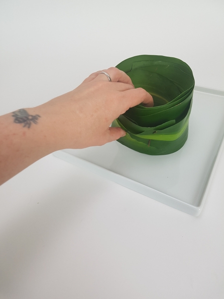 Set the leaf tube on a shallow display container Set the leaf tube on a shallow display container